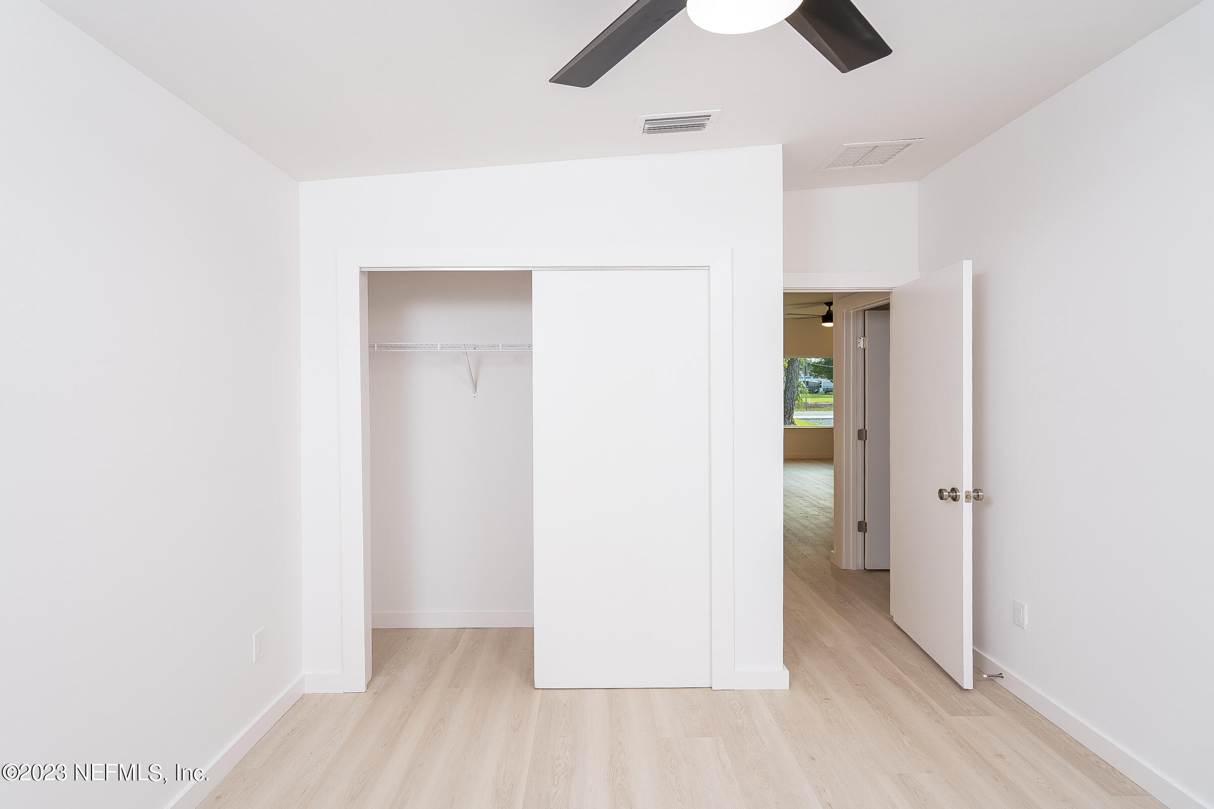 210 Yarbrough Road St. Augustine, FL 32095 - Photo 25 of 34 an empty room with closet and a chandelier fan