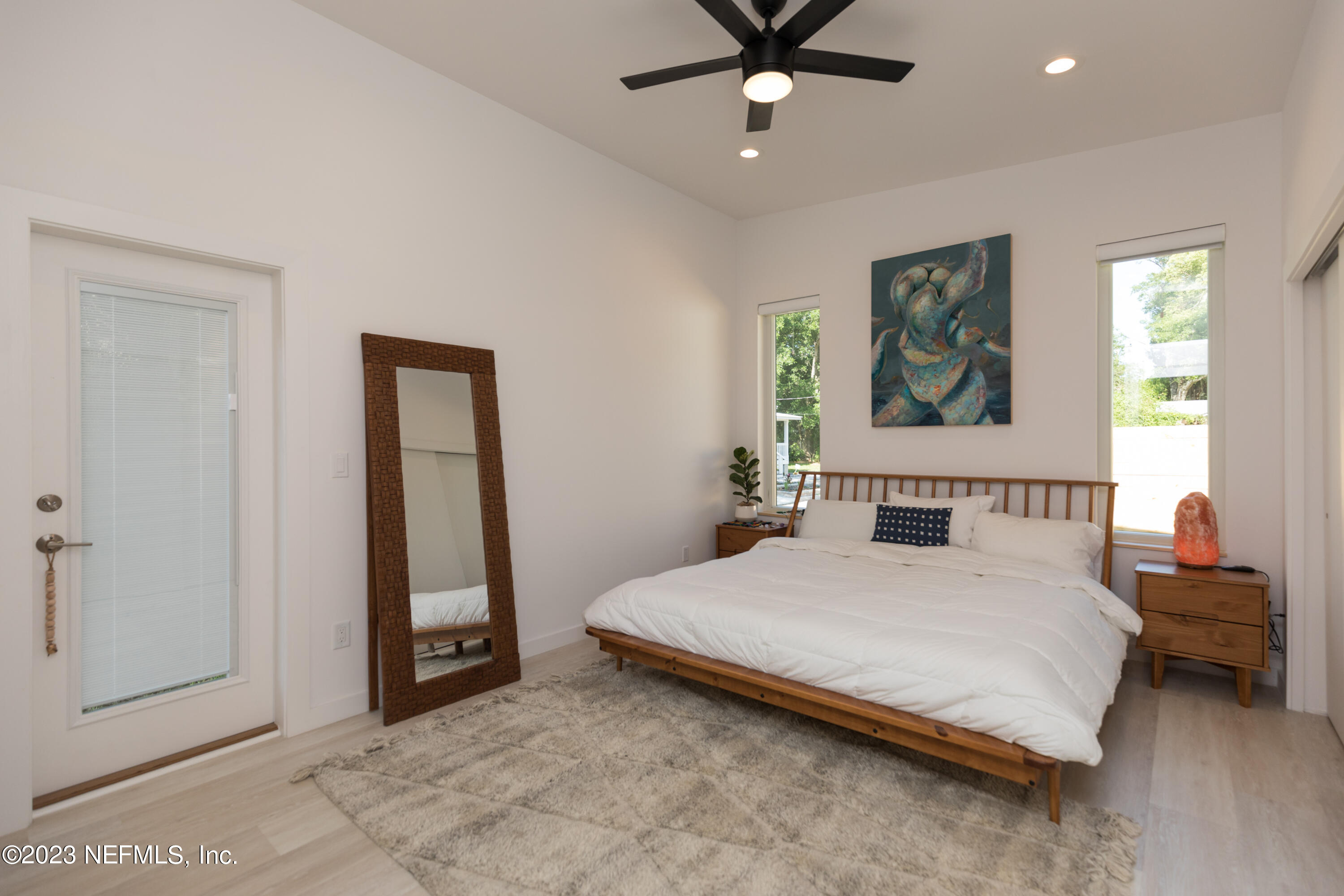 210 Yarbrough Road St. Augustine, FL 32095 - Photo 34 of 34 a bedroom with a bed and a painting on the wall