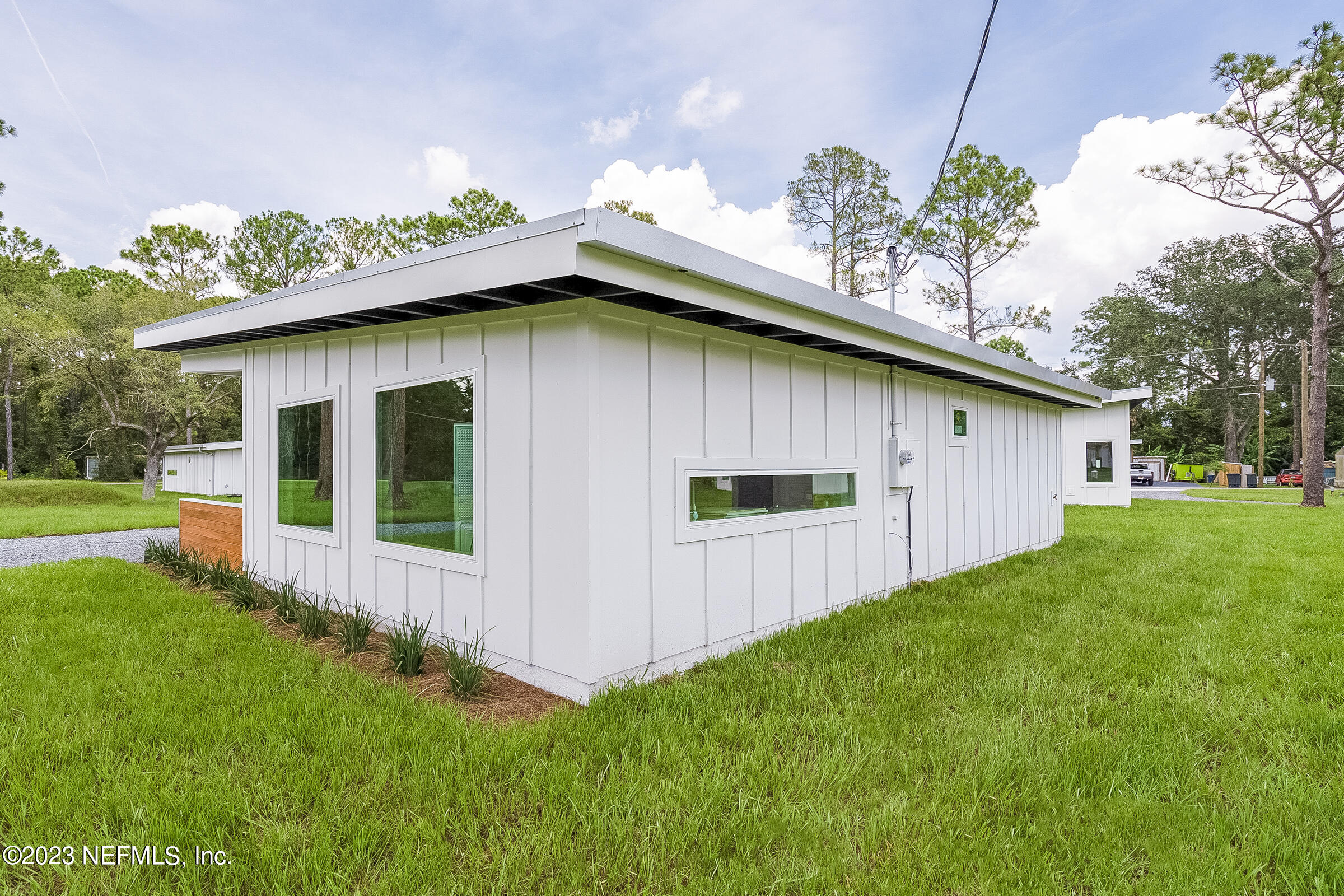210 Yarbrough Road St. Augustine, FL 32095 - Photo 5 of 34 a front view of house with yard and outdoor seating