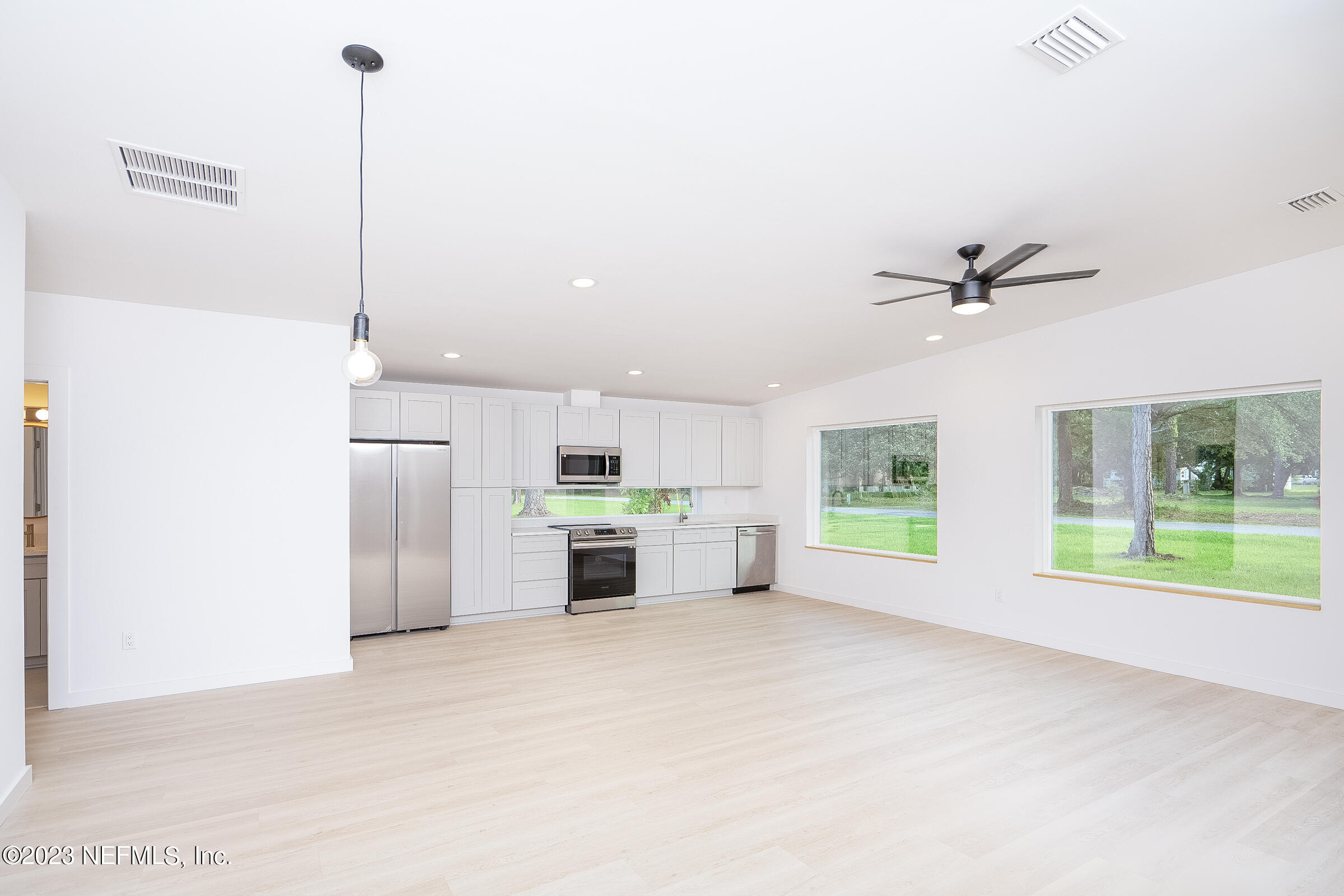 210 Yarbrough Road St. Augustine, FL 32095 - Photo 9 of 34 a view of a kitchen with a sink and a window