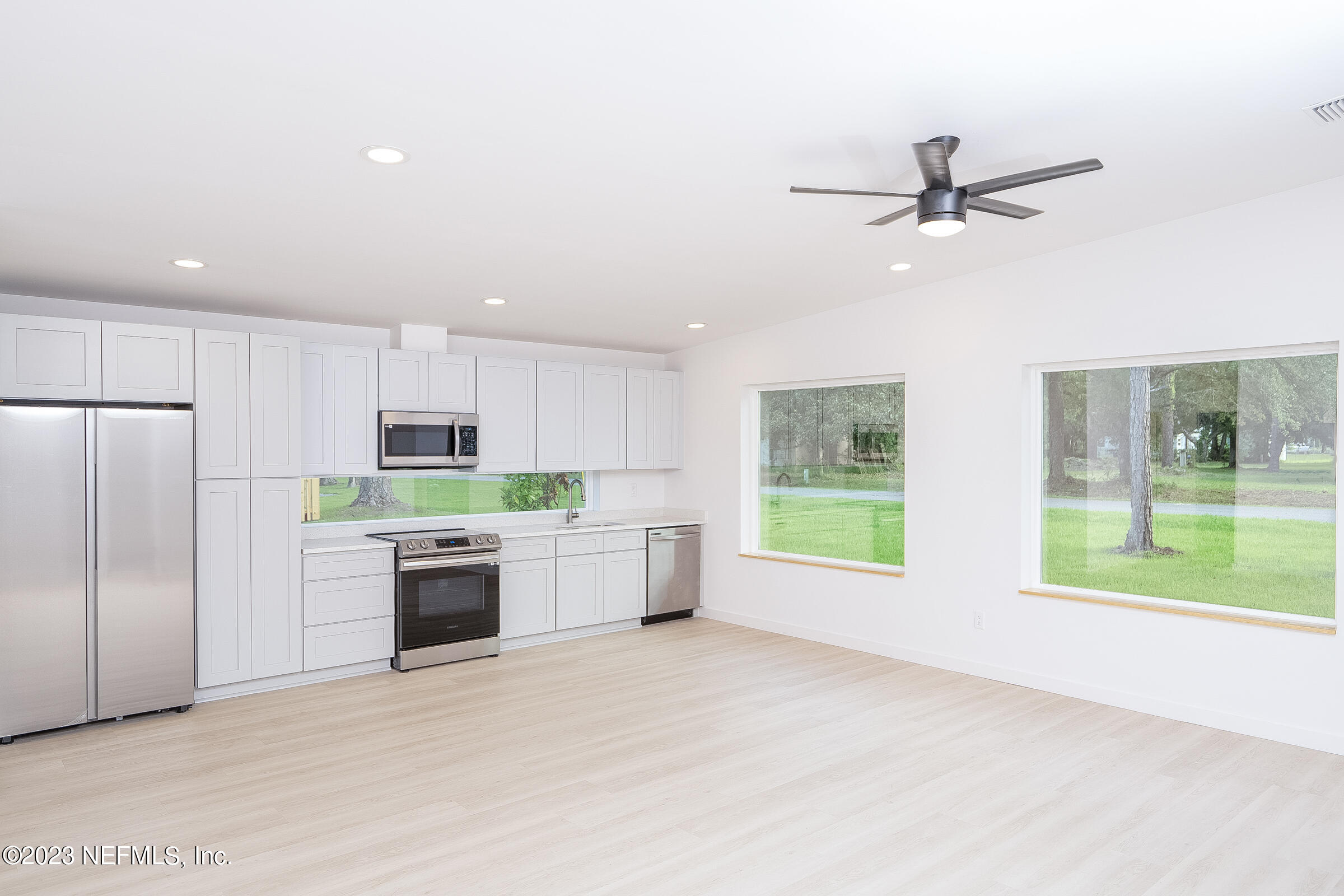 210 Yarbrough Road St. Augustine, FL 32095 - Photo 10 of 34 a kitchen with stainless steel appliances kitchen island granite countertop a refrigerator and a sink