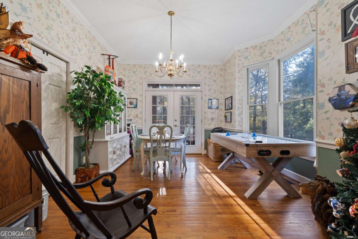 385 Stembridge Road Southeast Milledgeville, GA 31061 - Photo 11 of 81 a view of a dining room with furniture window and wooden floor