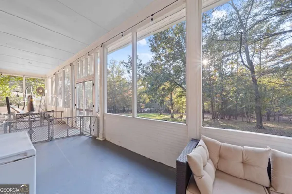 a view of a glass door and a yard