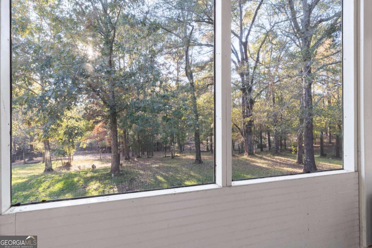 385 Stembridge Road Southeast Milledgeville, GA 31061 - Photo 15 of 81 a view of a glass door and a yard