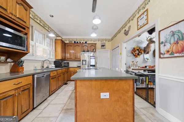 a kitchen with stainless steel appliances granite countertop a sink and cabinets