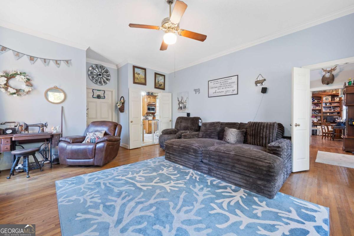 385 Stembridge Road Southeast Milledgeville, GA 31061 - Photo 23 of 81 a living room with furniture and wooden floor