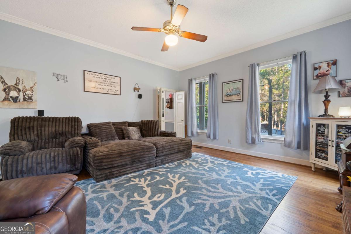 385 Stembridge Road Southeast Milledgeville, GA 31061 - Photo 24 of 81 a living room with furniture and a window