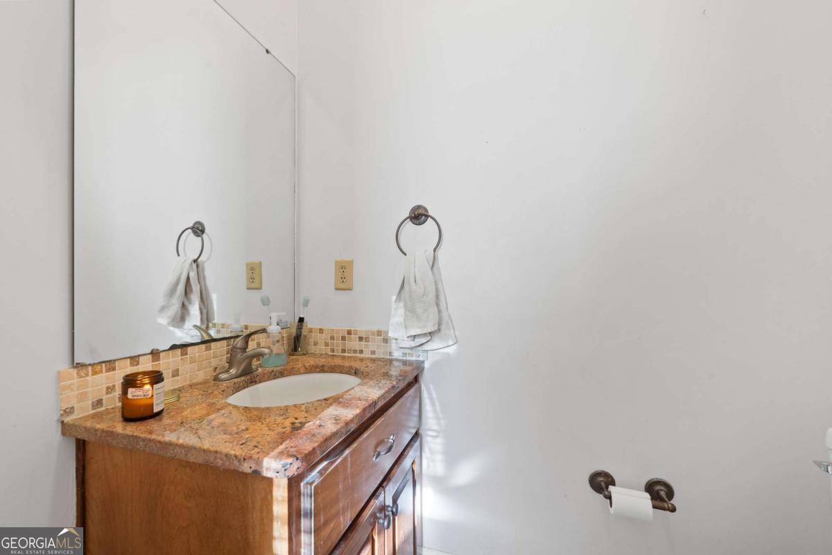385 Stembridge Road Southeast Milledgeville, GA 31061 - Photo 25 of 81 a bathroom with a sink and a mirror
