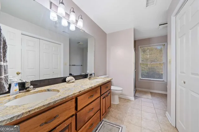 a living room with furniture a wooden floor and a window
