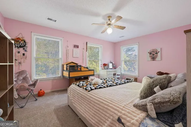 a view of a porch with a table and chairs