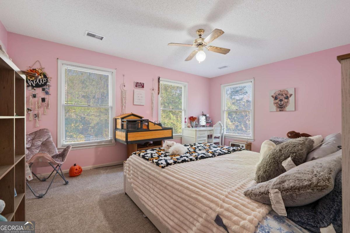 385 Stembridge Road Southeast Milledgeville, GA 31061 - Photo 34 of 81 a bedroom with a bed and window