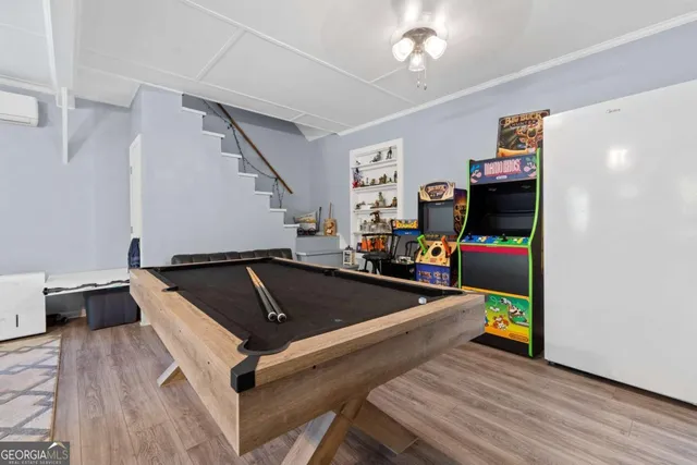 an aerial view of a house with a yard and garden