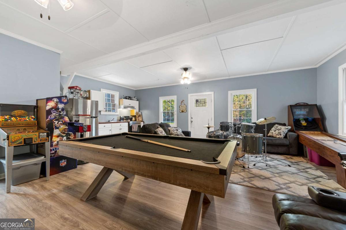 385 Stembridge Road Southeast Milledgeville, GA 31061 - Photo 42 of 81 a living room with furniture a couch and a dining table