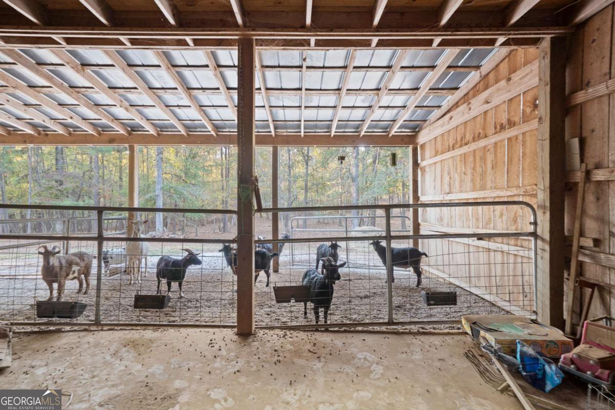 385 Stembridge Road Southeast Milledgeville, GA 31061 - Photo 53 of 81 a view of a porch with a table and chairs