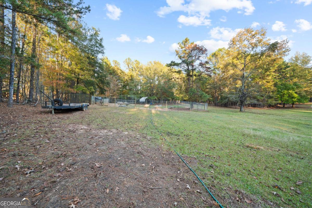 385 Stembridge Road Southeast Milledgeville, GA 31061 - Photo 56 of 81 a view of a field with trees in the background