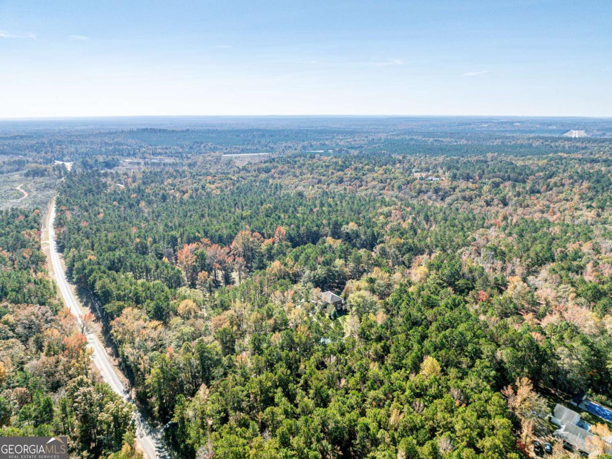 385 Stembridge Road Southeast Milledgeville, GA 31061 - Photo 72 of 81 an aerial view of house with yard and mountain view in back