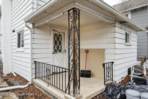 a view of a balcony with wooden floor