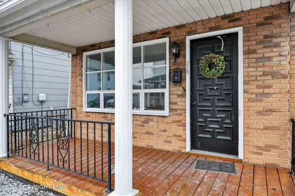 a front view of a house with a porch