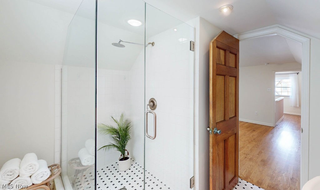 1200 Winston Road Cleveland, OH 44121 - Photo 23 of 35 Updated primary bathroom on-suite, featuring tiled floors and walk-in shower.