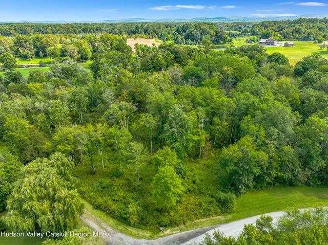 a view of a yard with an outdoor seating