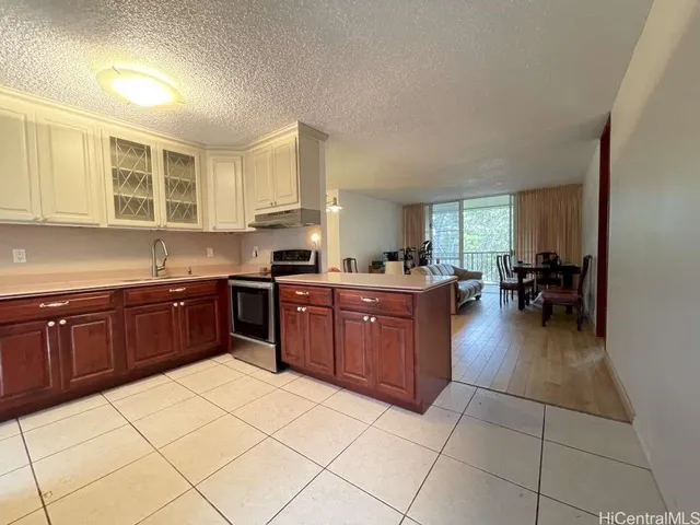 a kitchen with a sink a counter top space and appliances