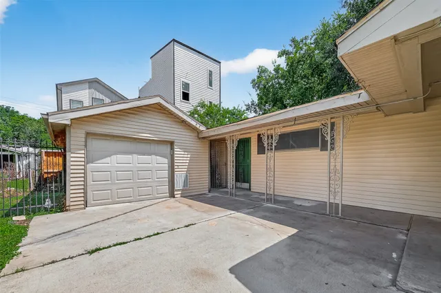 a front view of a house with a garage