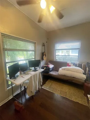 a bedroom with bed or couch and a chandelier