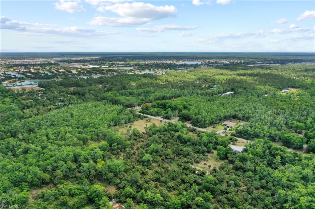 0 37th Avenue Northeast Naples, FL 34120 - Photo 13 of 35 an aerial view of residential houses with outdoor space and trees