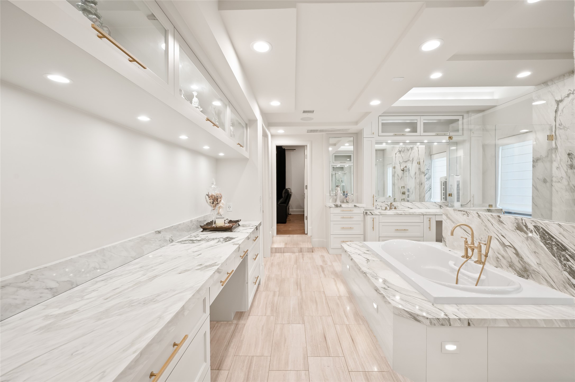 11518 Shadow Way Street Houston, TX 77024 - Photo 22 of 50 a spacious bathroom with a granite countertop sink a large mirror and bathtub