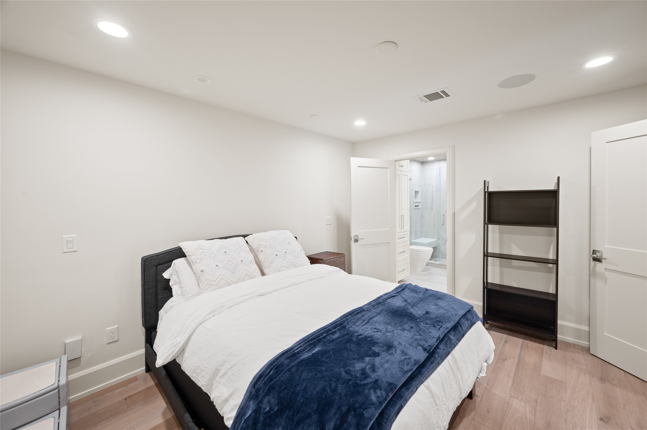 11518 Shadow Way Street Houston, TX 77024 - Photo 34 of 50 a spacious bedroom with a bed and a refrigerator