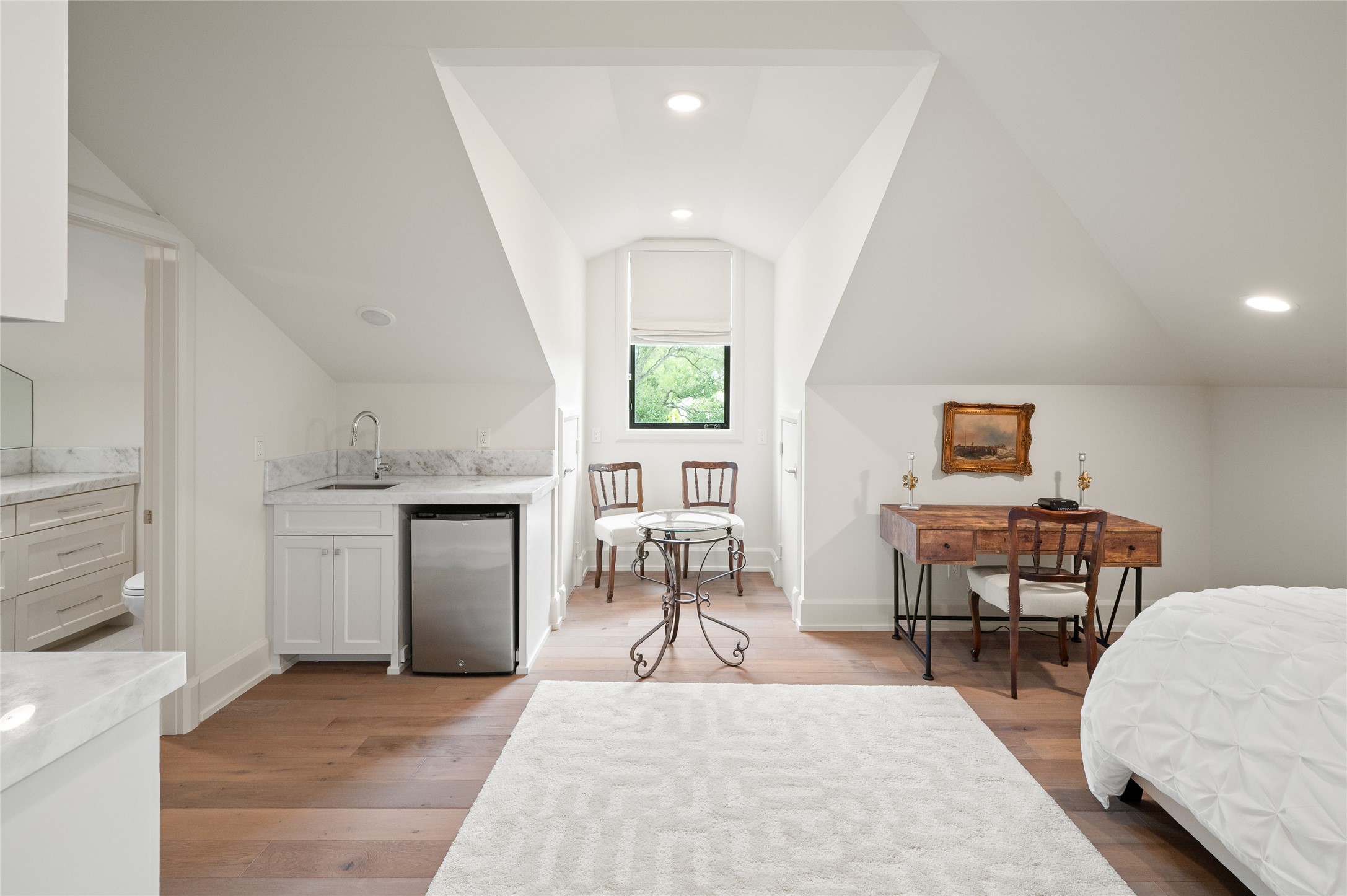 11518 Shadow Way Street Houston, TX 77024 - Photo 39 of 50 This inviting angle highlights the kitchenette with marble accents, seating space for a two-top table, and stylish pocket doors opening to the en-suite bath. Full Room dimensions are 17x30.