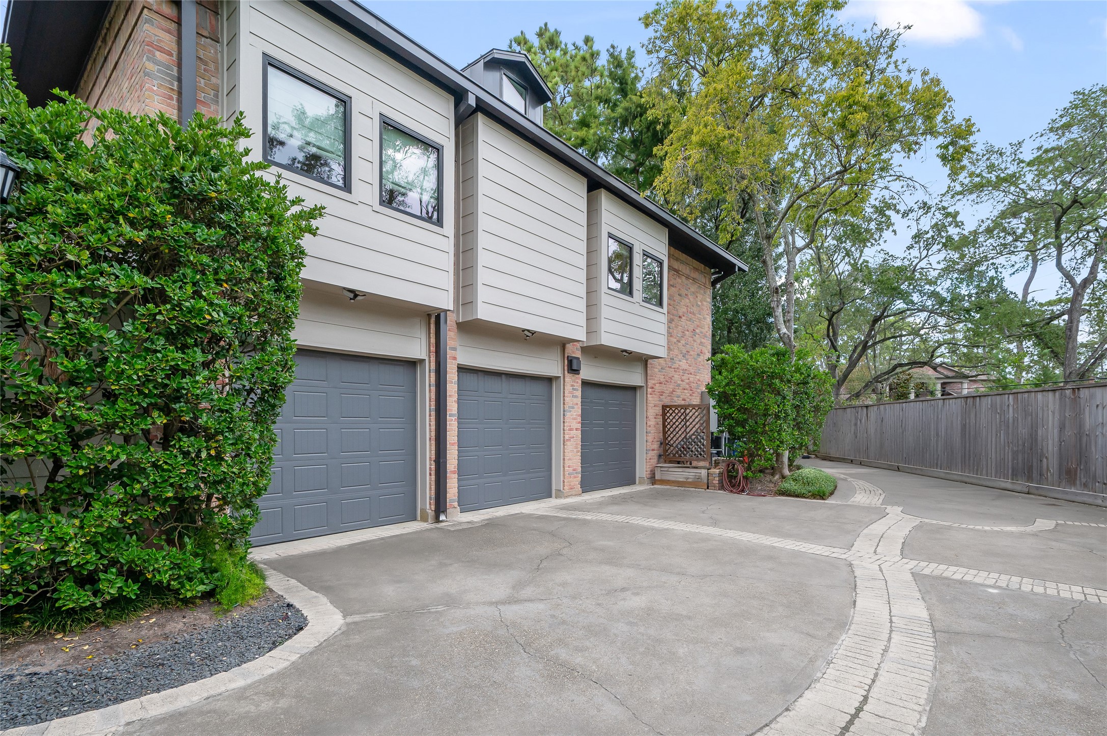 11518 Shadow Way Street Houston, TX 77024 - Photo 48 of 50 front view of a house with a yard and potted plants