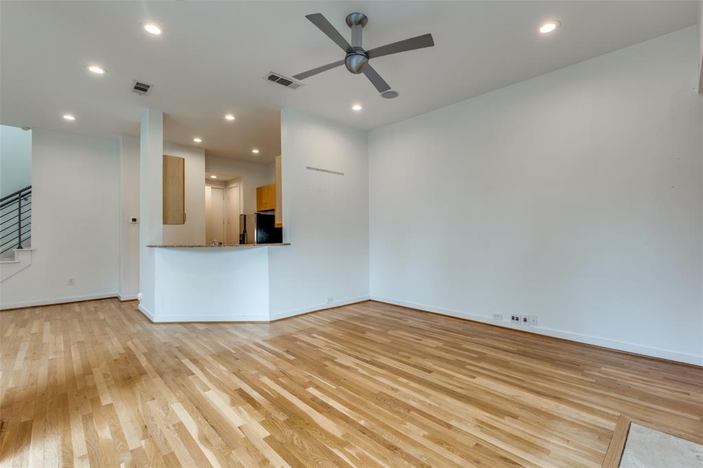 4302 Gilbert Avenue Dallas, TX 75219 - Photo 11 of 28 an empty room with wooden floor and windows