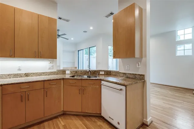 a kitchen with a sink and cabinets