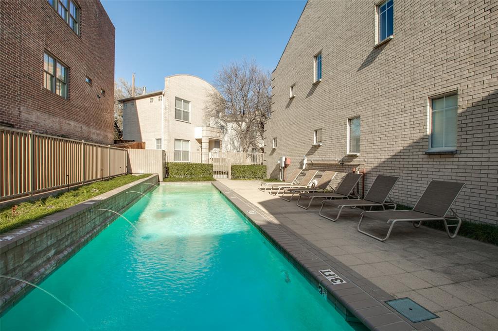 4302 Gilbert Avenue Dallas, TX 75219 - Photo 25 of 28 a view of an house with swimming pool
