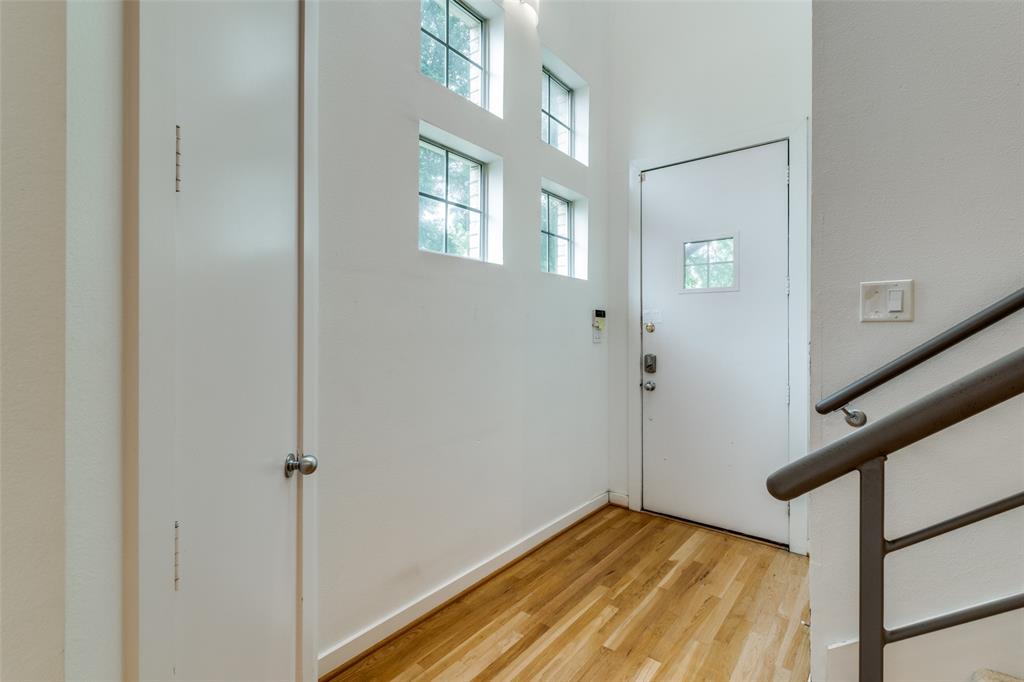 4302 Gilbert Avenue Dallas, TX 75219 - Photo 3 of 28 a view of an empty room with window and wooden floor