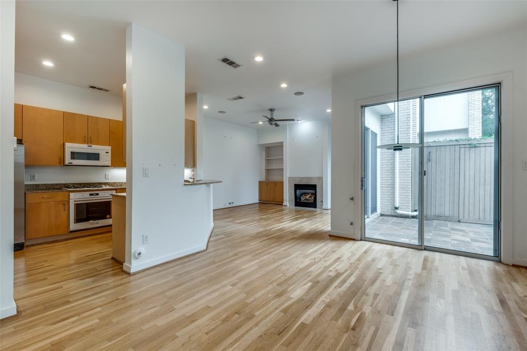 4302 Gilbert Avenue Dallas, TX 75219 - Photo 5 of 28 a view of a kitchen with a sink and a refrigerator