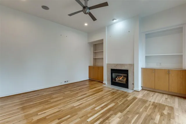 a view of an empty room with a fireplace