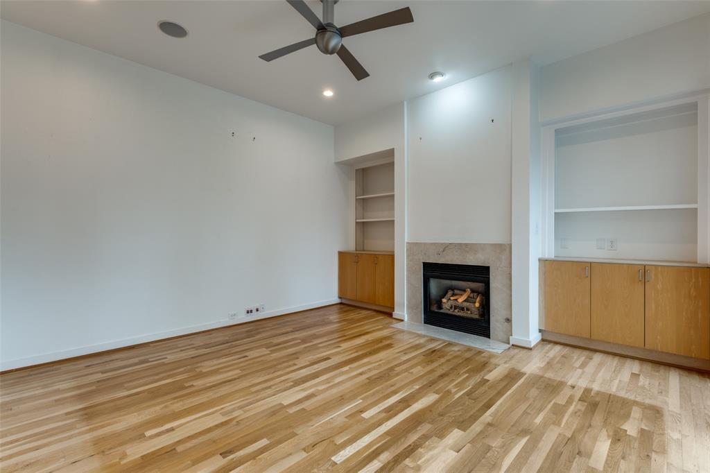 4302 Gilbert Avenue Dallas, TX 75219 - Photo 7 of 28 a view of an empty room with a fireplace