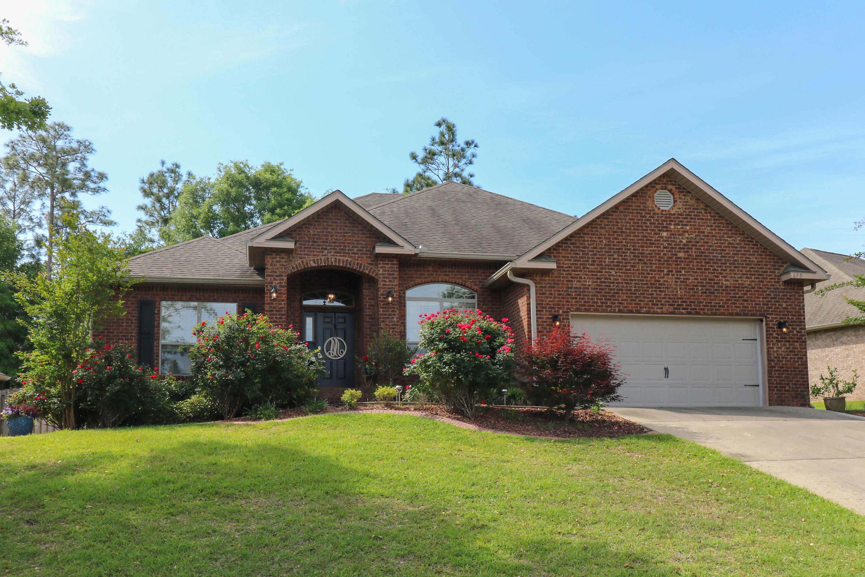 675 Red Fern Road Crestview, FL 32536 - Photo 1 of 35 a front view of house with a garden