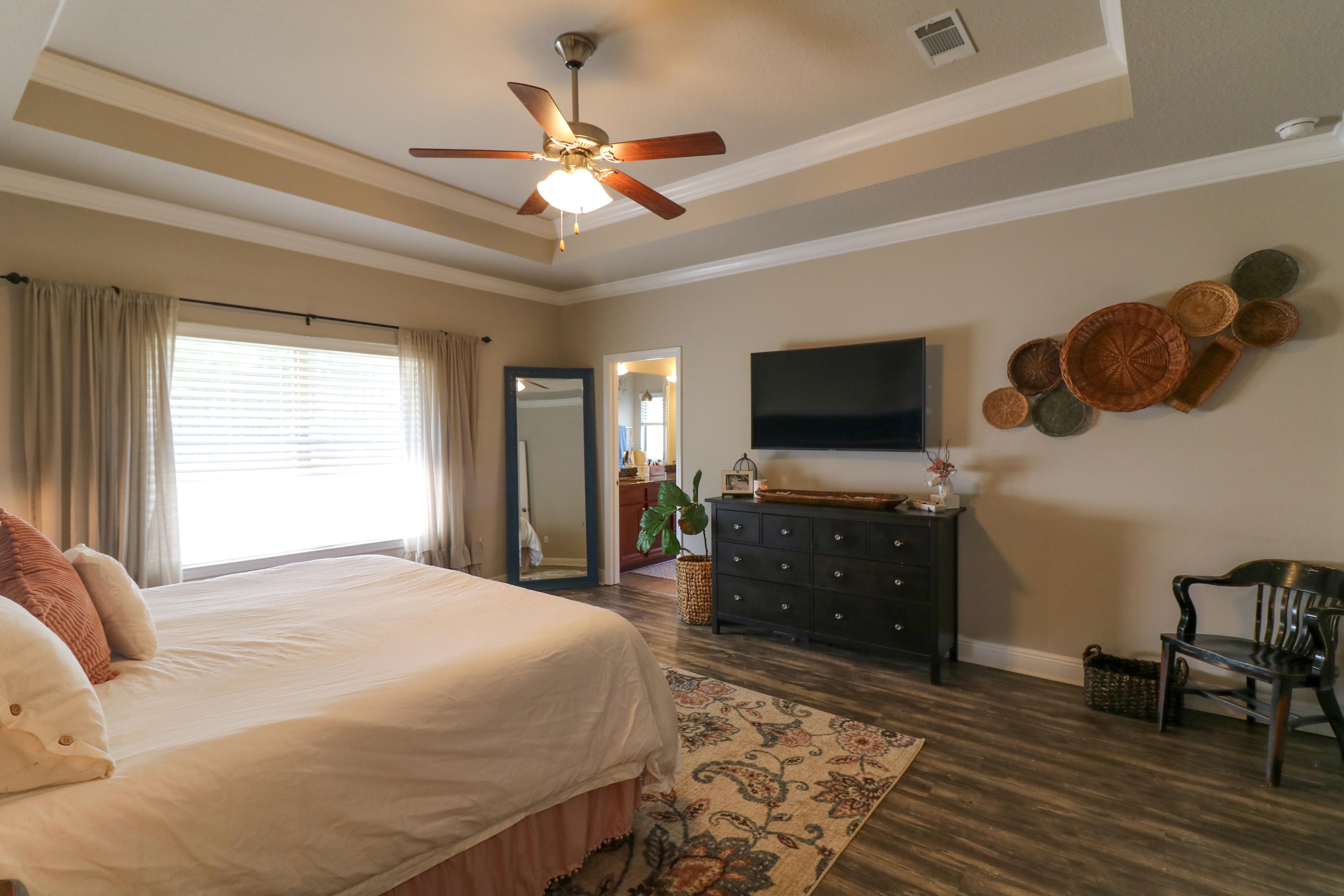 675 Red Fern Road Crestview, FL 32536 - Photo 15 of 35 a bedroom with a bed and a flat screen tv