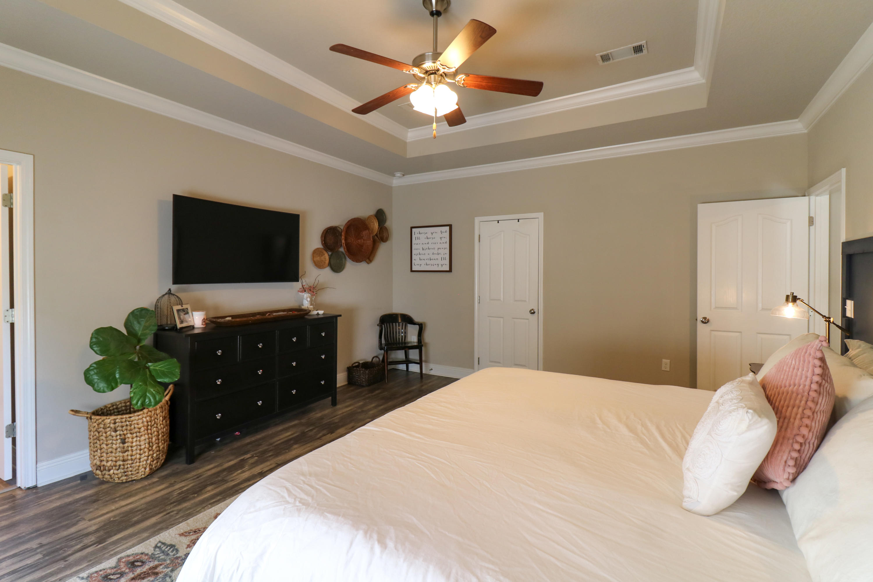 675 Red Fern Road Crestview, FL 32536 - Photo 16 of 35 a bedroom with a bed and a flat screen tv