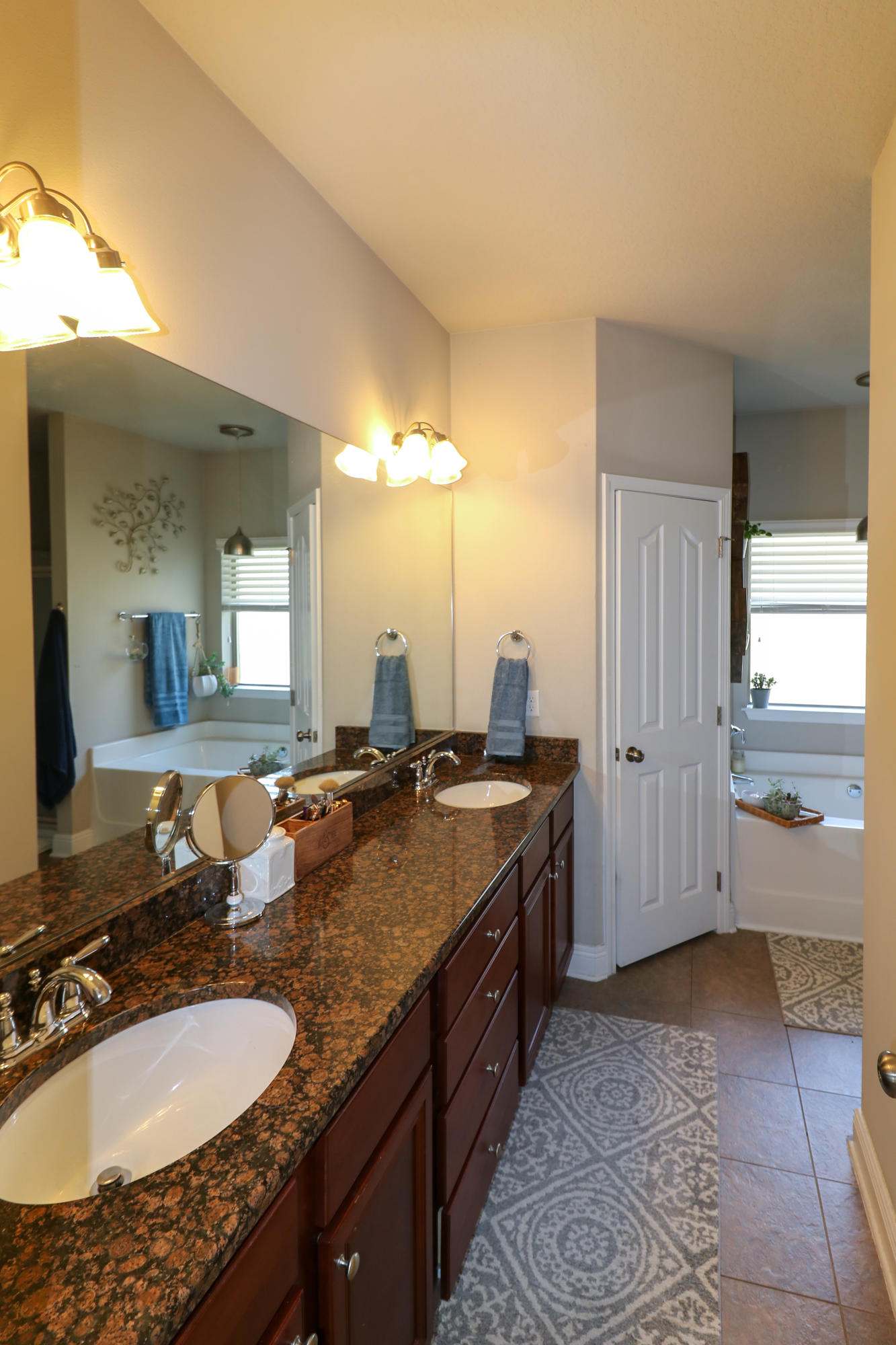 675 Red Fern Road Crestview, FL 32536 - Photo 17 of 35 a bathroom with a granite countertop double vanity sink and a mirror
