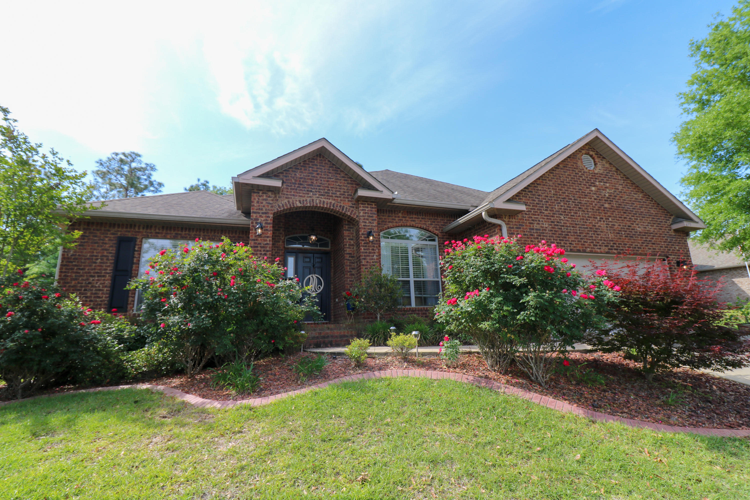 675 Red Fern Road Crestview, FL 32536 - Photo 2 of 35 a front view of a house with a yard