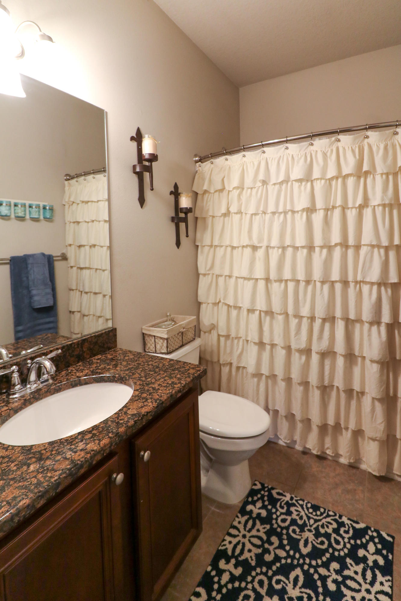 675 Red Fern Road Crestview, FL 32536 - Photo 22 of 35 a bathroom with a granite countertop sink toilet and shower