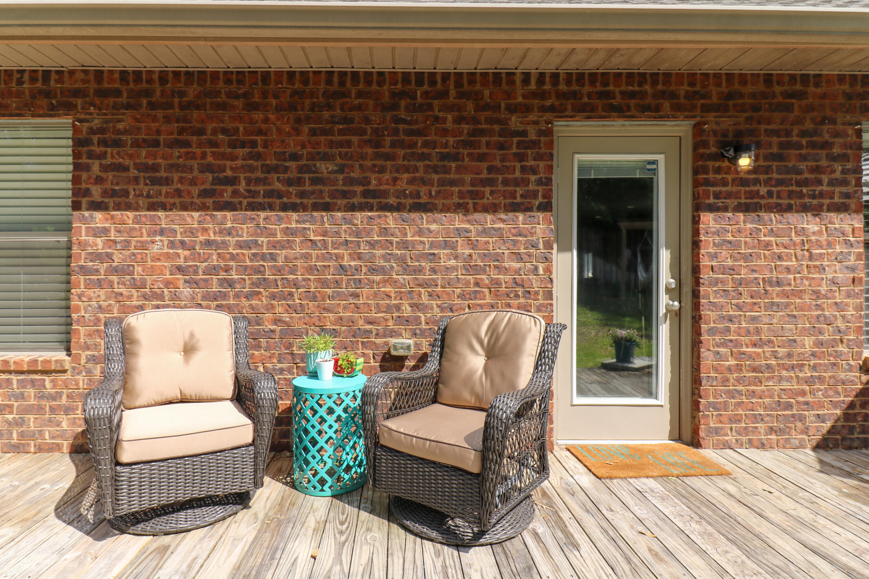 675 Red Fern Road Crestview, FL 32536 - Photo 33 of 35 a outdoor living space with patio furniture and a fireplace