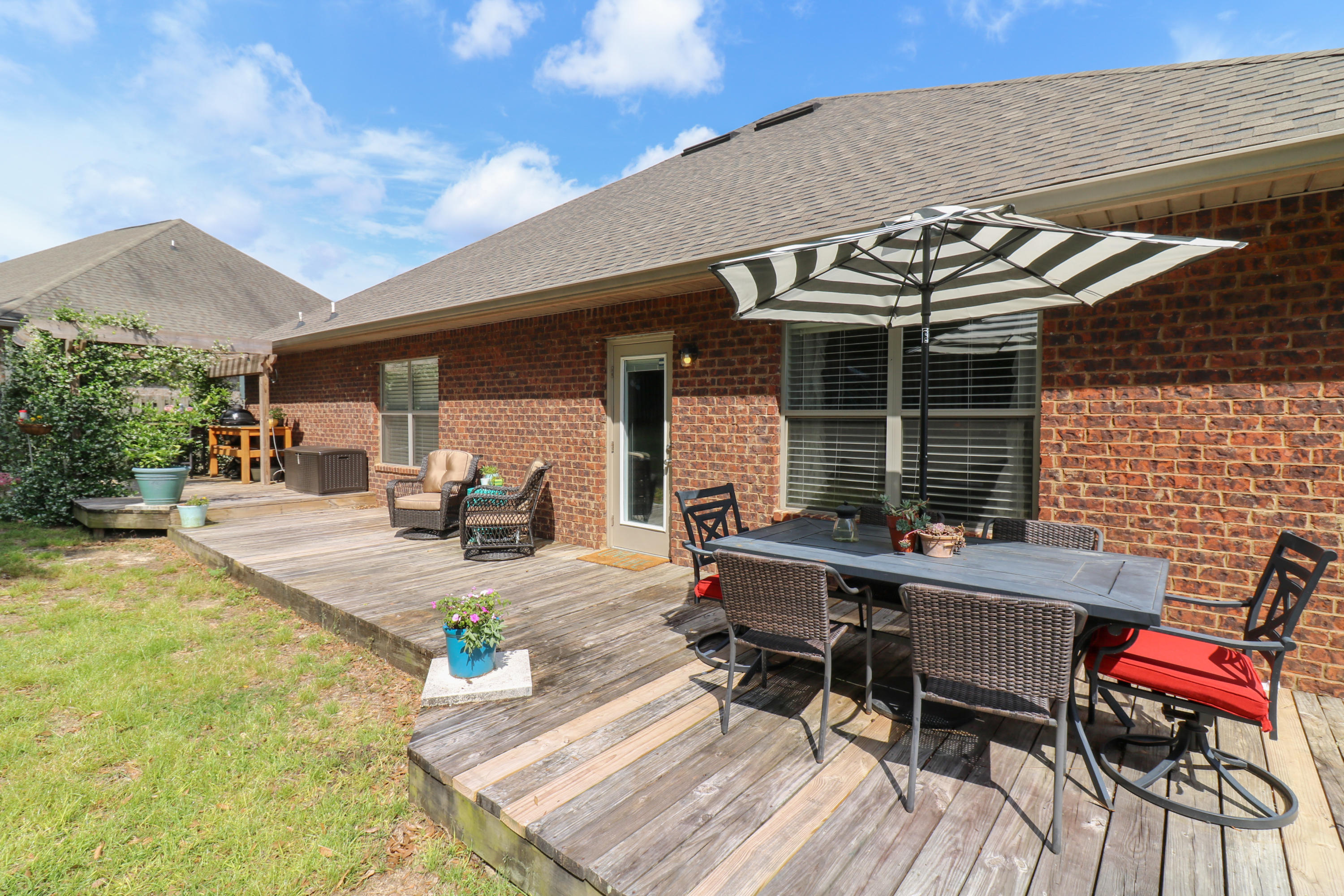 675 Red Fern Road Crestview, FL 32536 - Photo 34 of 35 a view of a backyard with sitting area