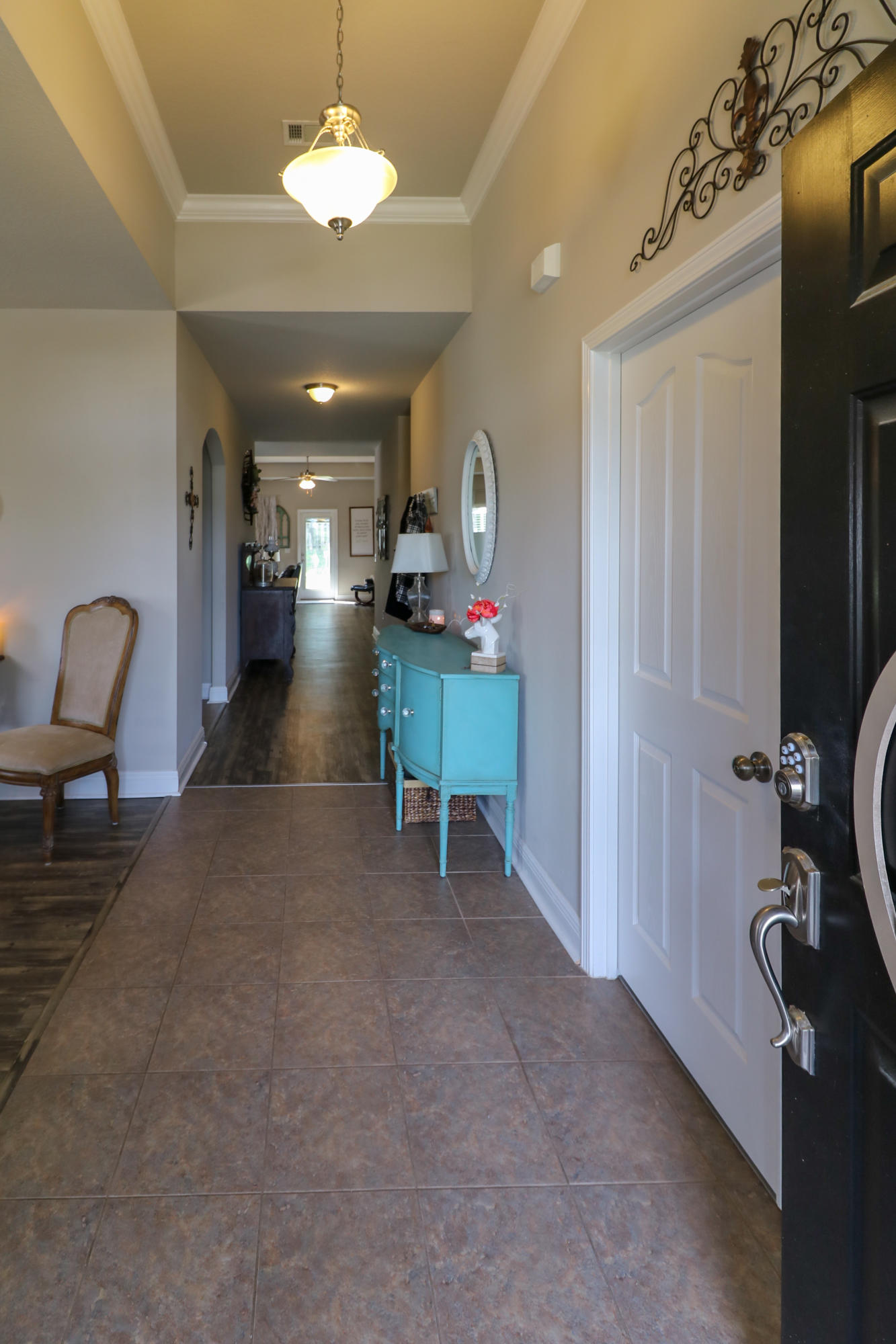 675 Red Fern Road Crestview, FL 32536 - Photo 5 of 35 a room with furniture and a chandelier
