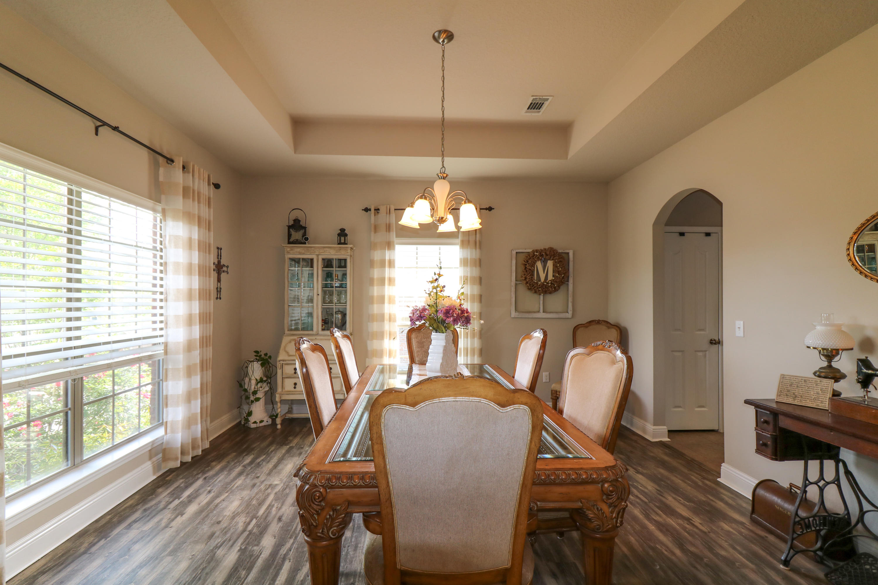 675 Red Fern Road Crestview, FL 32536 - Photo 6 of 35 a dining room with furniture a chandelier and wooden floor