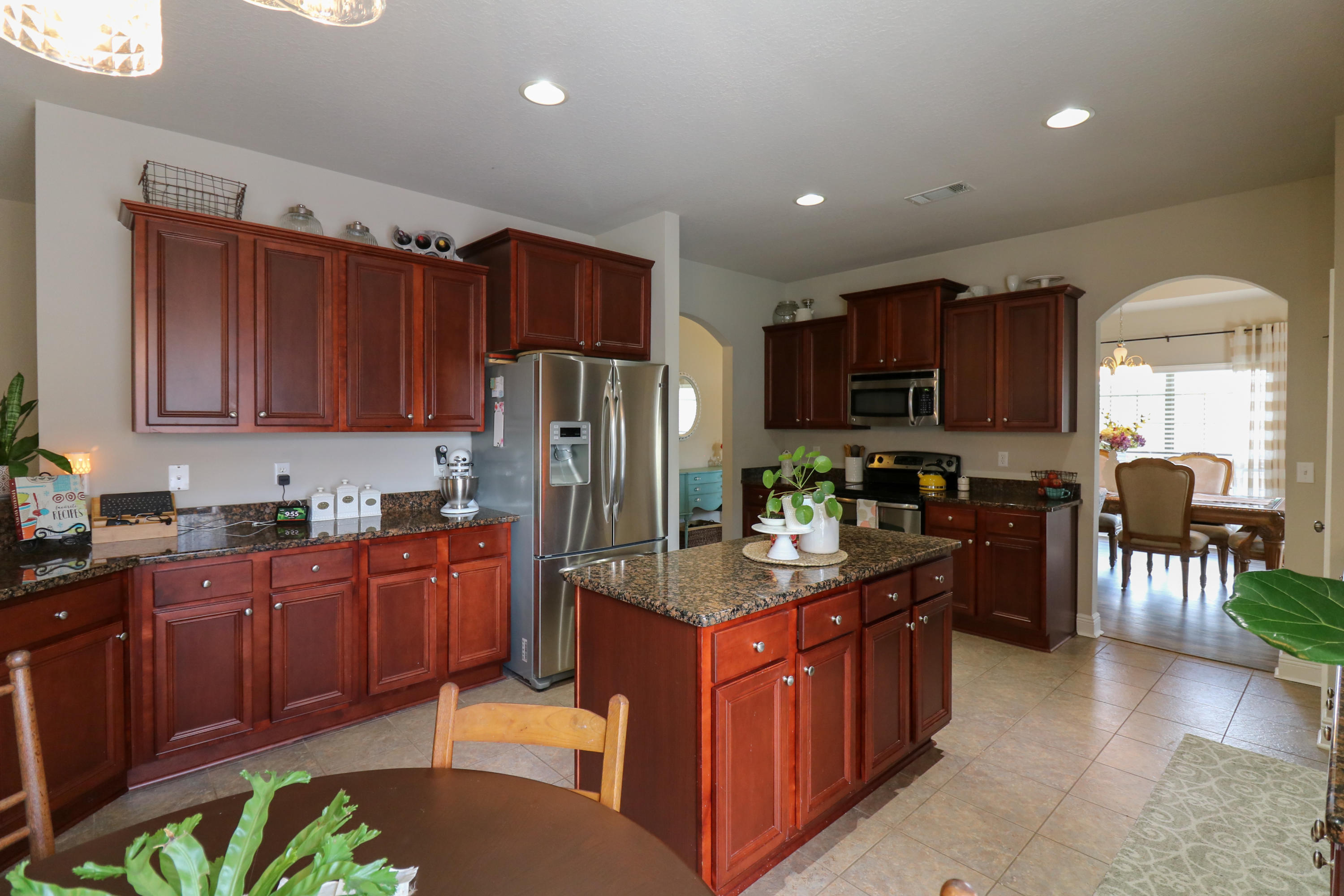 675 Red Fern Road Crestview, FL 32536 - Photo 9 of 35 a kitchen with stainless steel appliances granite countertop a refrigerator stove microwave and sink